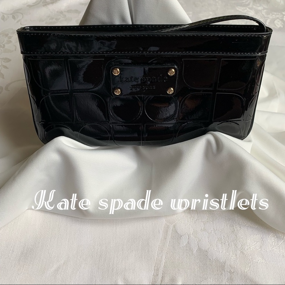 Kate spade black patent leather wristlets.